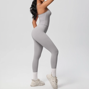 Detail view of gray two-piece yoga set with U-neck crop top and high-waisted leggings