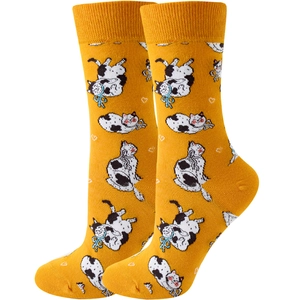 Close-up of yellow crew socks featuring cute cartoon cat patterns and white heart details