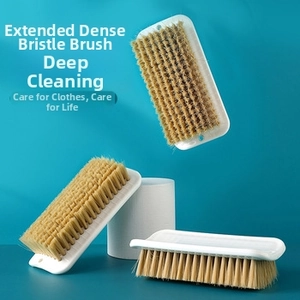Detail showing high-density yellow bristles and ergonomic long handle of the cleaning brush