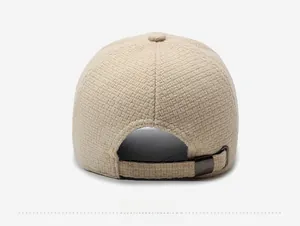 Detail of the oatmeal tweed baseball cap back with adjustable dark grey metal buckle
