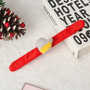 Plush red Christmas slap bracelet featuring a decorative boot with snowflake embroidery