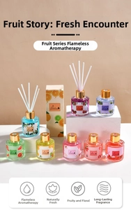 Detailed set of colorful fruit scented reed diffusers with decorative glass bottles and reeds