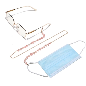 Pink crystal and gold chain strap for glasses and masks shown on white background