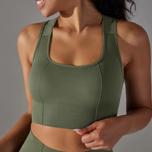 Close-up of seamless dark green sports bra showing knitted texture and ribbed underband