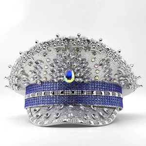 Detail of silver sequin captain hat featuring blue rhinestones and rainbow gems