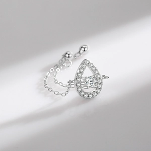 Elegant S925 silver hollow teardrop ring with a sparkling centerpiece on a chain band