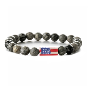 Detailed shot of elastic beaded bracelet with marble texture and American flag bead
