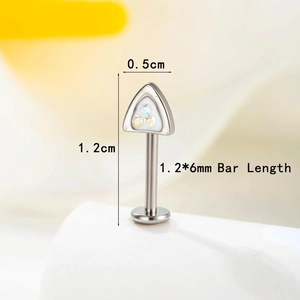Triangle F136 titanium labret piercing with rainbow crystals on a white stand