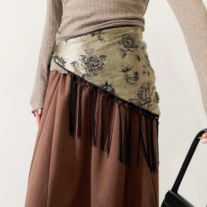 Detail of vintage bronze triangular waist scarf with rose pattern and black tassels
