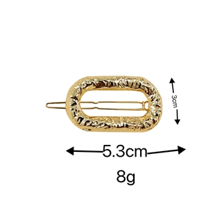 Golden metal hair clip with hammered texture, dimensions 5.3cm length and 3cm width