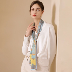Abstract oil painting style long skinny silk scarf worn by model on beige background