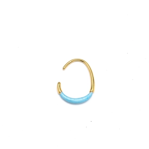 Detail of 18K gold U-shaped earring featuring sky blue enamel with fine spiral texture
