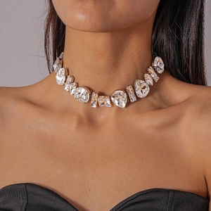 Close-up of luxury choker necklace with oversized geometric crystals on a female model