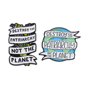 Enamel pins featuring Destroy the Patriarchy and Not the Planet eco-feminism themes