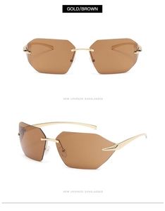 Close-up of rimless geometric sunglasses with gold metal temples and brown lenses