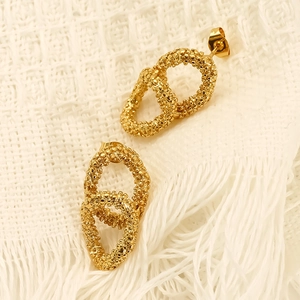 Gold plated stainless steel oval interlocking earrings with granular texture