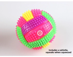 Macro detail of multicolor spiky massage ball with squeaker hole and textured surface