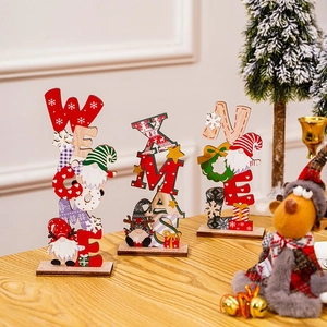 Detail of Christmas wooden table signs with NOEL and XMAS text and festive gnome designs