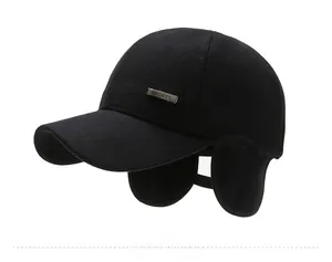 Side view of winter baseball cap for men with ear flaps and metal sports badge detail