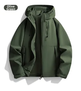 Detail view of olive green hooded jacket showing matte windproof fabric and zipper pockets