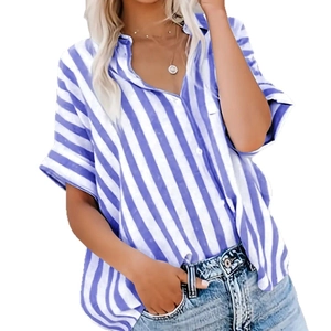 Women's blue and white striped short sleeve button shirt paired with denim jeans