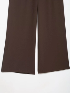 Detailed texture of dark brown crepe wide-leg pants with high-quality knit finish