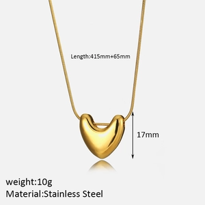 Detail view of gold heart pendant with snake chain, stainless steel material specs