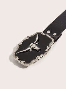Close-up of punk style black leather belt featuring a silver bull head metal buckle