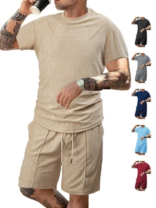 Detail of waffle knit fabric texture on men's summer casual short sleeve and drawstring shorts set