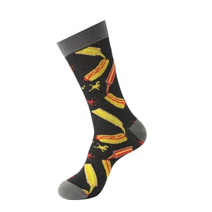 Detail of crew socks with hot dog, mustard, and tomato sauce print on black knit fabric