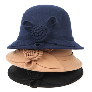 Elegant women's wool felt cloche hats in navy, camel, and black with floral detail