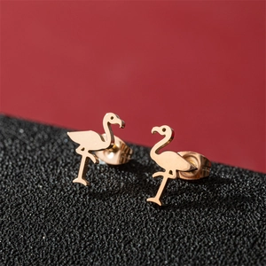Minimalist rose gold flamingo stud earrings in stainless steel on red and black background