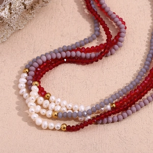 Bohemian multilayer necklace with natural pearls, red crystals and gold spacer beads
