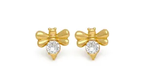 Detail view of golden bee stud earrings featuring sparkling round cubic zirconia stones