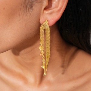 Detail of 18k gold plated long fringe earrings with multi-layer chains and beads