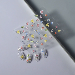 Detail of colorful butterfly and floral nail art stickers with embossed 3D texture