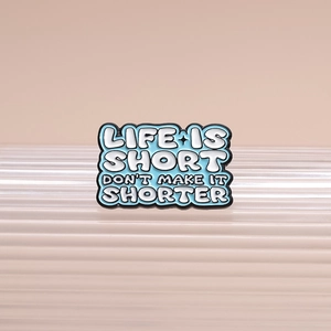 Blue enamel pin with 'LIFE IS SHORT' quote for bags and clothing accessories