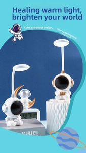 Close-up of LED astronaut desk lamp with flexible neck and circular light on blue background