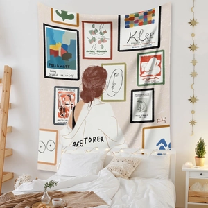 Detail of bohemian wall tapestry featuring abstract art gallery motifs in a cozy bedroom