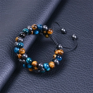 Detail of 8mm Evil Eye bracelet with tiger eye stones and adjustable braided cord