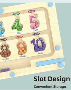Detail of magnetic stylus pen in the storage slot of the wooden color sorting toy