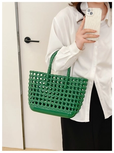 Green hollow woven jelly basket bag styled with a white shirt for beach vacation look