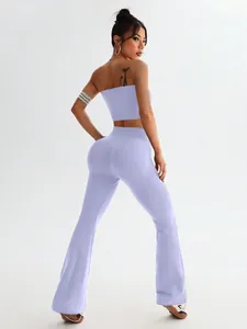 Detail view of lavender seamless yoga set with ribbed texture and flared high waist leggings