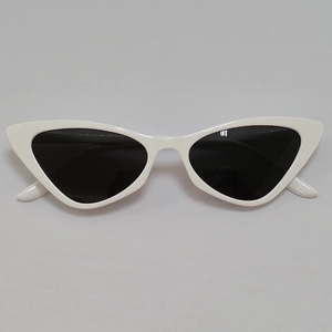 Detailed front view of white cat-eye sunglasses with dark lenses and glossy frames