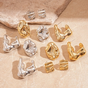 Lava texture geometric metal hoop earring set in polished gold and silver finishes