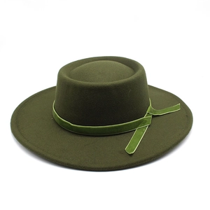 Detailed view of the olive green wool felt fedora with a velvet ribbon and bow accent