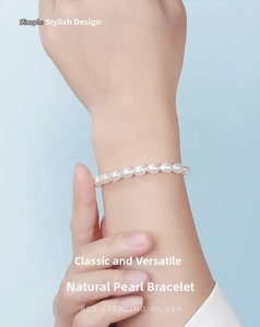 Macro detail of natural freshwater pearl bracelet with s925 sterling silver chain adjustor