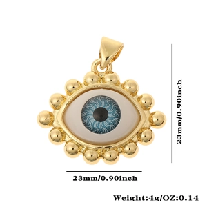 Detail showing the 23mm golden evil eye pendant with blue enamel and crystal zircon
