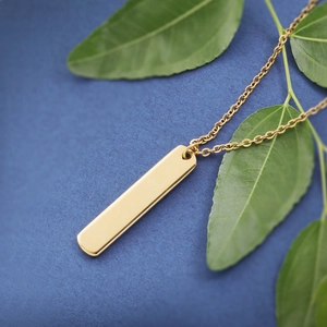 Polished gold rectangular bar pendant necklace with a minimalist geometric link chain