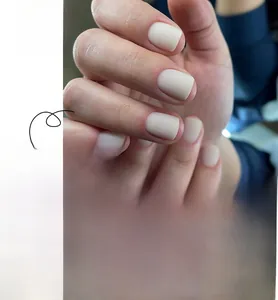 Macro detail of matte off-white square press-on nails with product code JP3174 shown